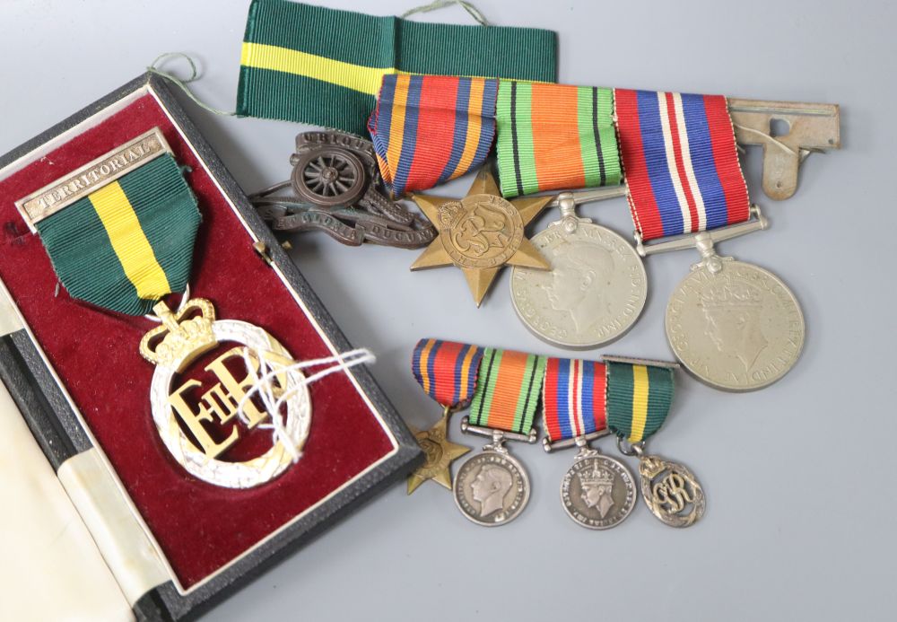 A WWII medal group (War, Defence and Burma Star) and a 1955 Territorial Efficiency medal (cased), with miniatures, a leather holster